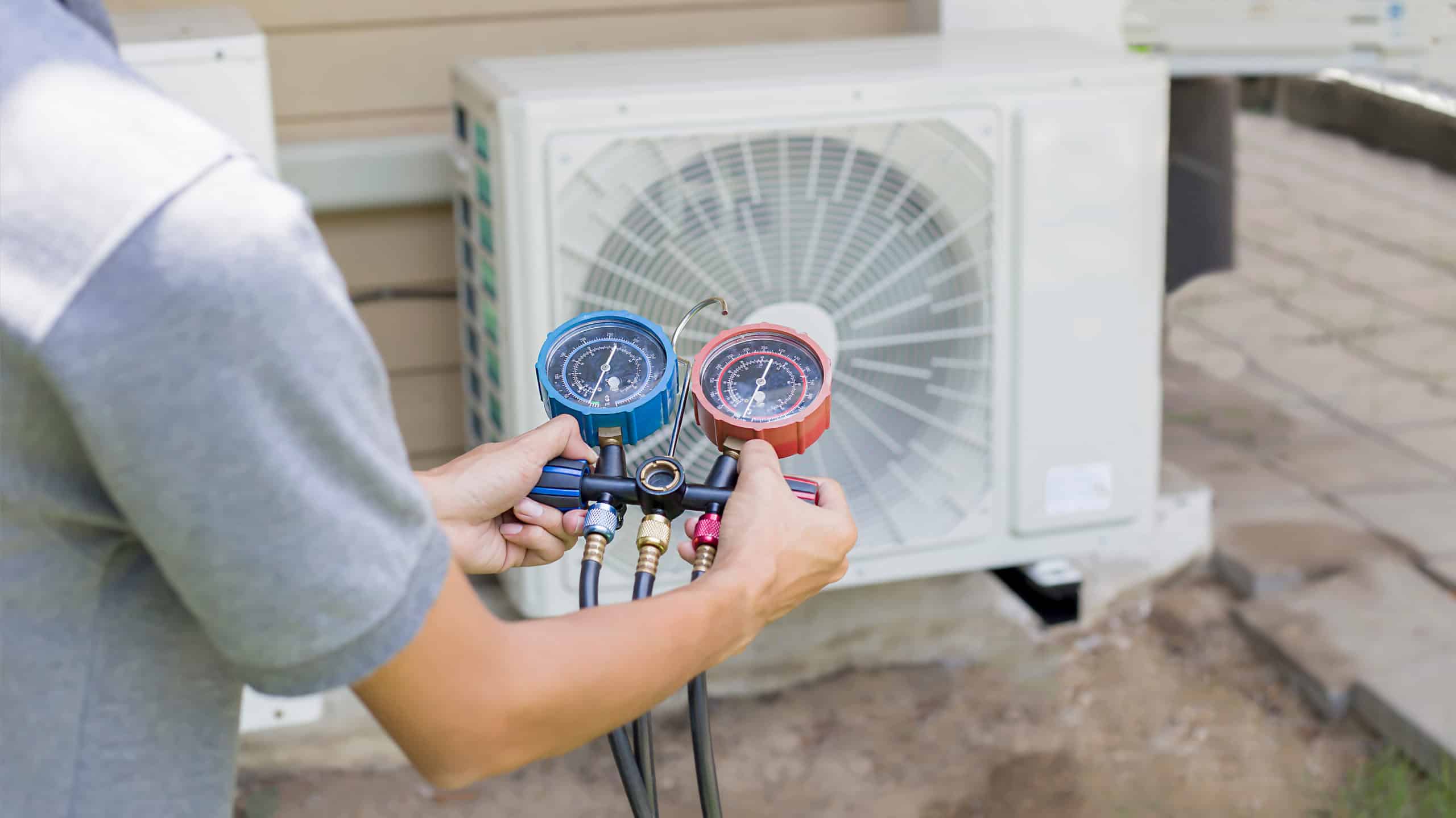 air conditioning repair in conroe texas, air conditioner repair services. ac being repaired by technician