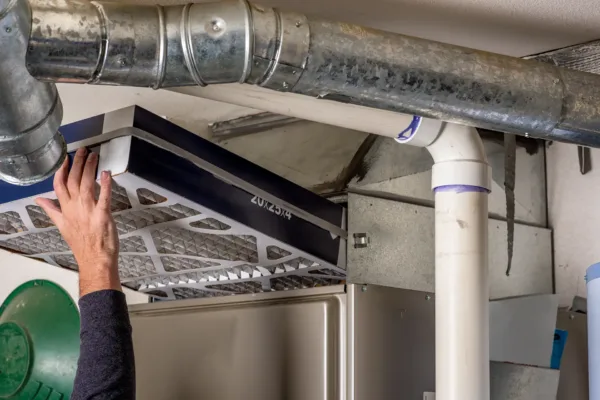 furnace filter being installed